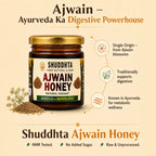 A jar of Shuddhta Ajwain Honey on a warm beige background with promotional text and icons. The amber glass jar has a gold cap and a label reading 'SHUDDHTA AJWAIN HONEY NATURAL VARIANT.