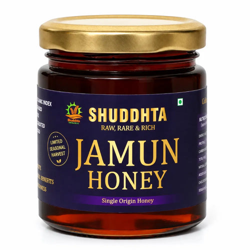 A jar of Shuddhta Jamun Honey with a gold-colored metal lid and a dark purple label, shown on a clean white background.