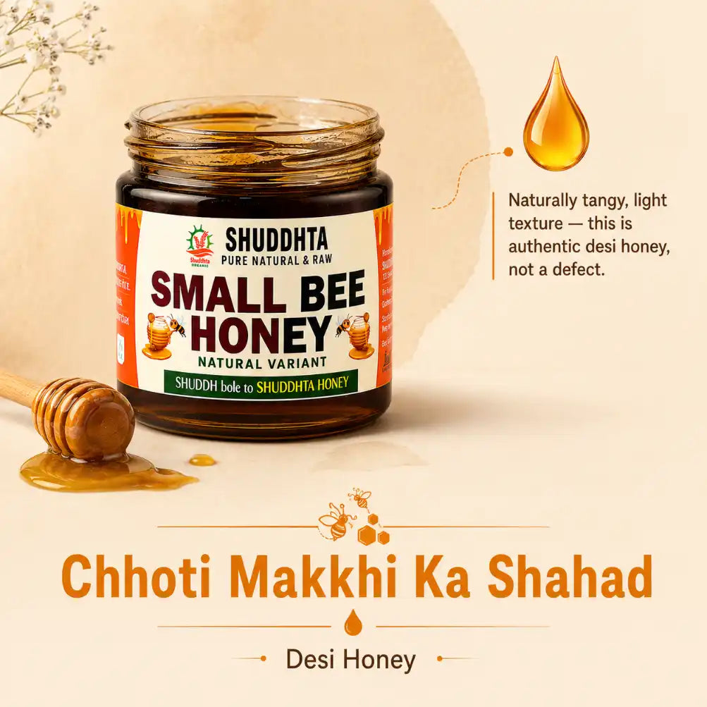 A jar of Shuddhta Small Bee Honey displayed on a warm beige background with decorative honeycomb props, a honey dipper, and text overlays describing the product as Chhoti Makkhi Ka Shahad and Desi Honey.