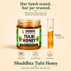 A jar of Shuddhta Tulsi Honey is shown on a warm beige background with supporting text and icons. The label reads 'Shuddhta Pure Natural & Raw Tulsi Honey Natural Variant.
