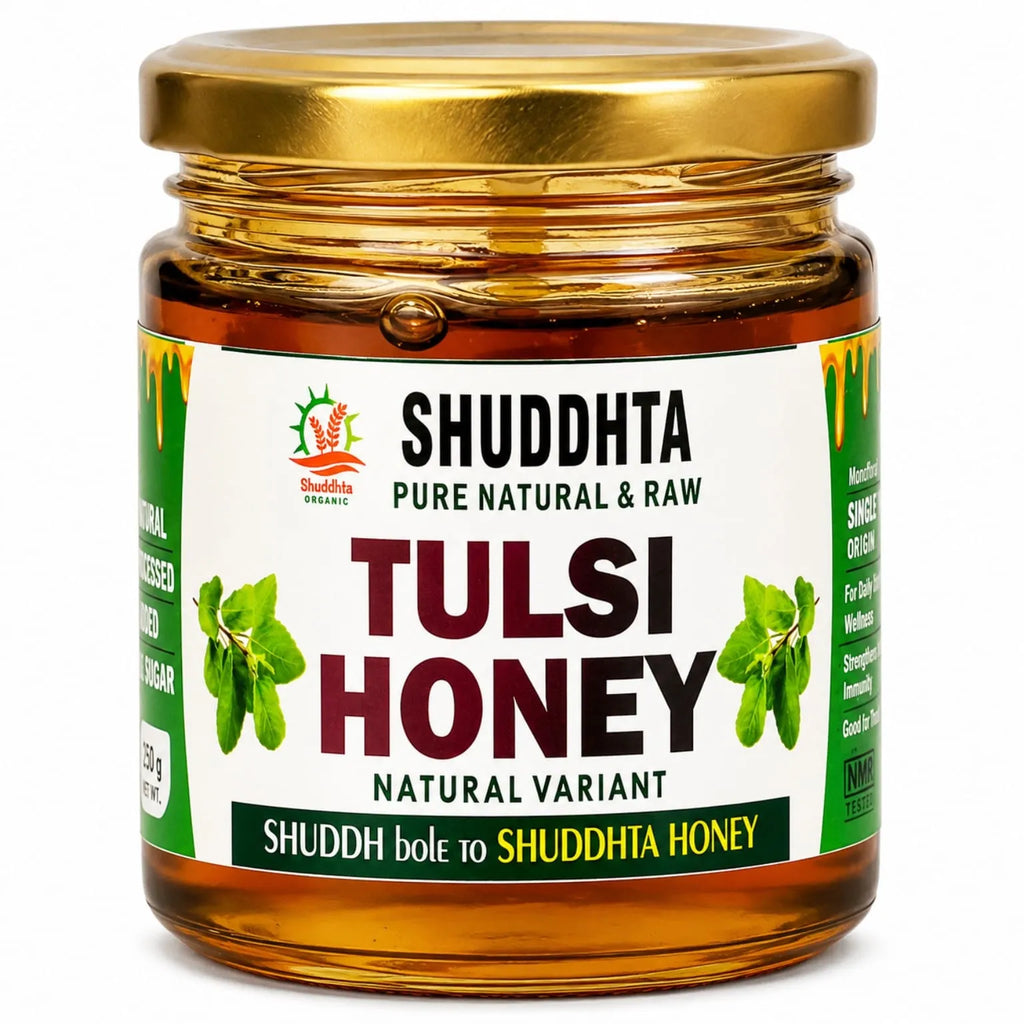 A jar of Shuddhta Tulsi Honey with a gold metal lid and a white label featuring green and red text, set against a plain white background.