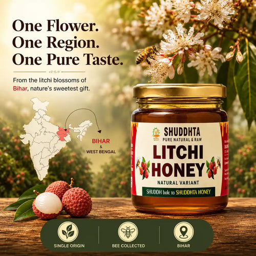 A jar of Shuddhta Pure Natural & Raw Litchi Honey displayed on a rustic wooden surface with fresh lychee fruits, flowers, and a bee in a garden setting. The image includes promotional text highlighting the product's origin in Bihar, West Bengal, and feature icons at the bottom.